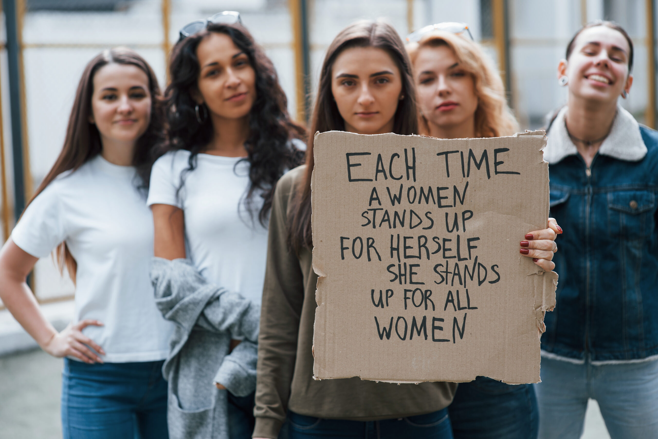 Peaceful protest. Group of feminist women have demonstration for their rights outdoors.